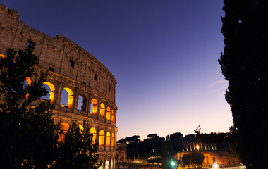 Fototapeta na wymiar Colosseum at dusk in Rome, Italy