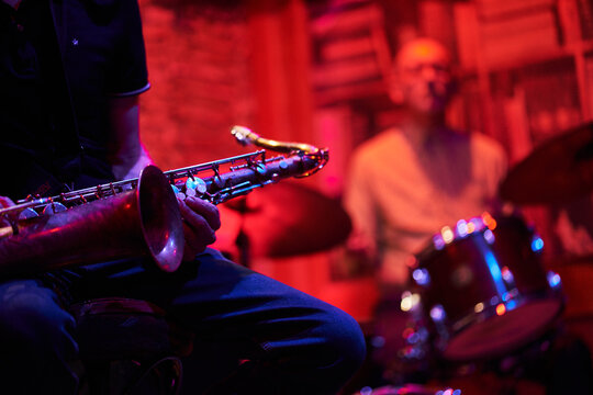 Saxophone And Drummer At A Jazz Concert