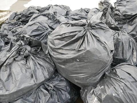 pile of garbage bag black bin waste background.