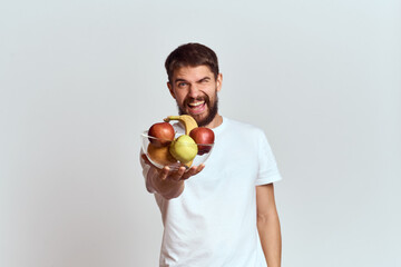 man with fresh fruit in a glass cup gesturing with hands vitamins health energy model bushy beard mustache