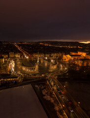 Aerial drone shot of Heroes Square in the night in Budapest winter with city lights