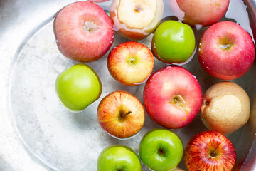 Washing fresh apples in the water