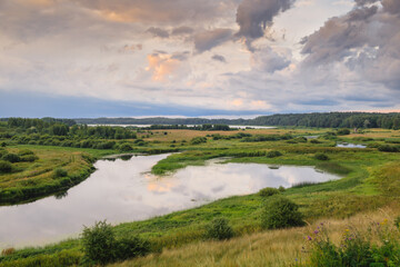 Magnificent evening landscape on the river bank