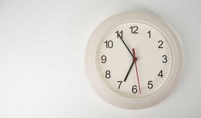 White clock isolated on white background Showtime 06.55 am, Time concept.