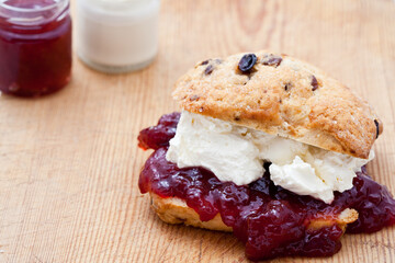 Fresh home baked scone with jam and clotted cream
