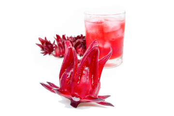 roselle juice (healthy drink) in glass with ice and dried roselle fruit flowers