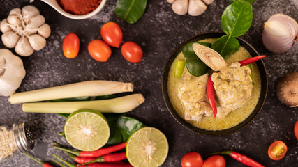 Green curry made with chicken, chili, and basil, with tomato, lime, kaffir lime leaves and garlic.