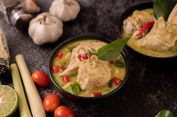 Green curry made with chicken, chili, and basil, with tomato, lime, kaffir lime leaves and garlic.