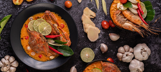 Tom yum crab with lemon, chili, tomato, garlic, lemongrass, kaffir lime leaves in a plate