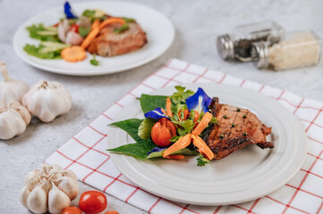Pork Steak with Tomato, Carrot, Red Onion, Peppermint, Butterfly Pea Flower, and Lime.