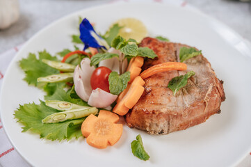 Pork Steak with Tomato, Carrot, Red Onion, Peppermint, Butterfly Pea Flower, and Lime.