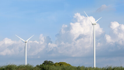 wind turbines plant for electric power production with blue sky ,clean energy concept