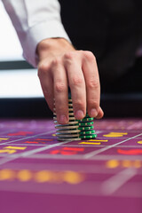 Dealer placing chips on table