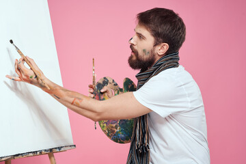 painter holding palette drawing art easel hobby creativity pink background