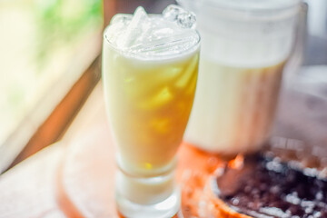  milk in the glass on the background of nature.