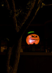 Inflateable Halloween pumpkin sitting on a wall
