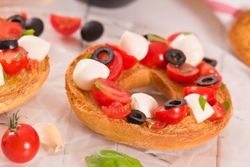 Friselle with tomatoes and mozzarella cheese.