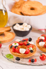 Friselle with tomatoes and mozzarella cheese.