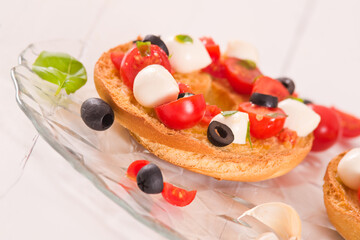 Friselle with tomatoes and mozzarella cheese.