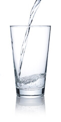 Pour water into a glass placed on a white background.