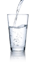 Pour water into a glass placed on a white background.