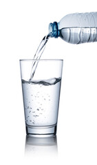 Pour water into a clear glass placed on a white background.