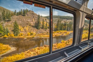 View of the Autumn Colors from a Passenger Train in the Rocky Mountain Section of a Popular...