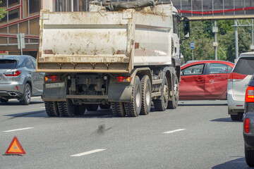          Accident of a truck and car on a large urban multi-lane road.