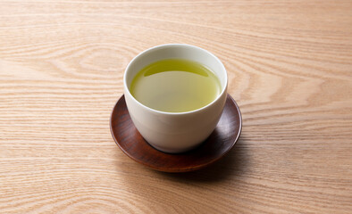 Obraz na płótnie Canvas Green tea on a wooden tray.