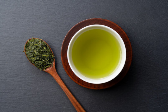 Green tea placed on a black background with space. Image of Japanese green tea