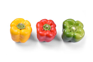 Yellow red and green paprika chilli on white background