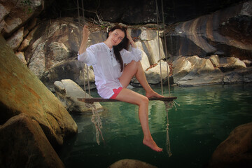 person sitting on rocks