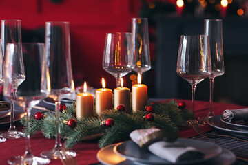 Beautiful table setting with Christmas decorations in living room