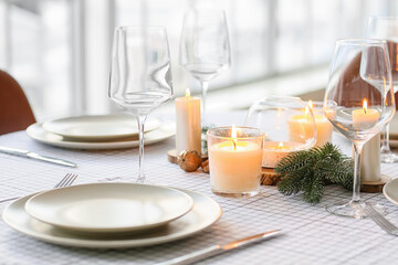 Beautiful table setting with Christmas decorations in living room