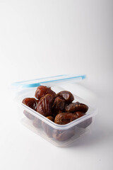 date palm dried in a clear plastic box