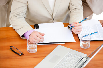 Close-up of a businessman working in a meeting