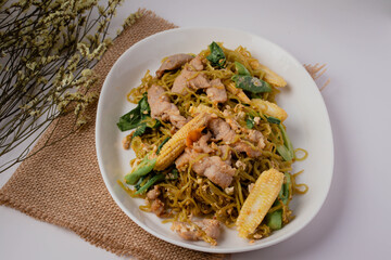 Fried jade noodles with soy sauce and pork