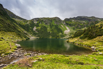 beautiful mountain lake in a green landscape