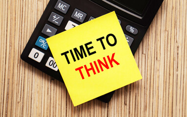 calculator with text TIME TO THINK with yellow paper