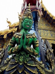 Chiang Rai. Thailand, June 16, 2017: Wat Rong Suea Ten. One of the green sculptures of the Blue Temple in Chiang Rai, Thailand