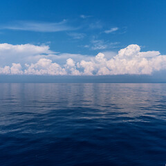 Calm sea and cloudy sky pierced with sun rays. Beautiful nature background.