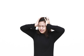 Portrait of young asian woman isolated on white background suffering from severe headache, pressing fingers to temples, closing eyes to relieve pain with helpless face expression.