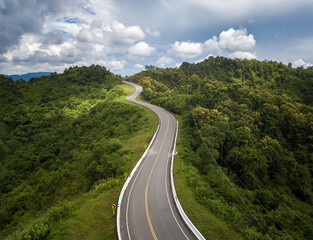Aerial view of beautiful steep curved road (look like number 3) on the high mountain in Nan...