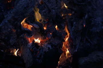 yellow fire flames in the bonfire