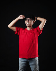Fototapeta premium Young men in empty red T-shirts, stylish and posing like famous T-shirt models. Men's t-shirt template and mockup design for print.