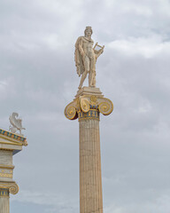 Obraz premium Apollo statue the ancient Greek god under cloudy sky