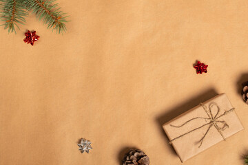 Christmas composition. Gifts, fir tree branches, red decorations. Christmas, winter, new year concept. Flat lay, top view, copy space.