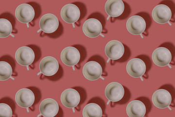 Cups pattern. Repeating white cups on a pink background. Top view of white cups for coffee. Horizontal.