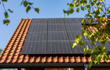 Solar electric panels on a house roof in  Ochojno. Poland