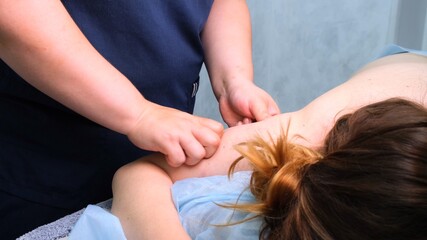 Anti-cellulite massage for a fat woman. Aggressive fight against fat. Spa treatment.
